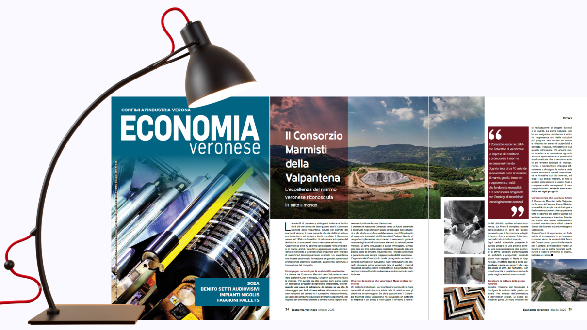 Lampada da tavolo che illumina copertina e pagine interne della rivista Economia Veronese